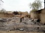 Nigeria_Baga Une jeune fille parmi les ruines brûlées d'une partie de la ville de Baga, au Nigeria (photo prise à l'aide d'un portable).